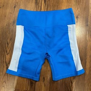 Blue biker shorts. Mid thigh length